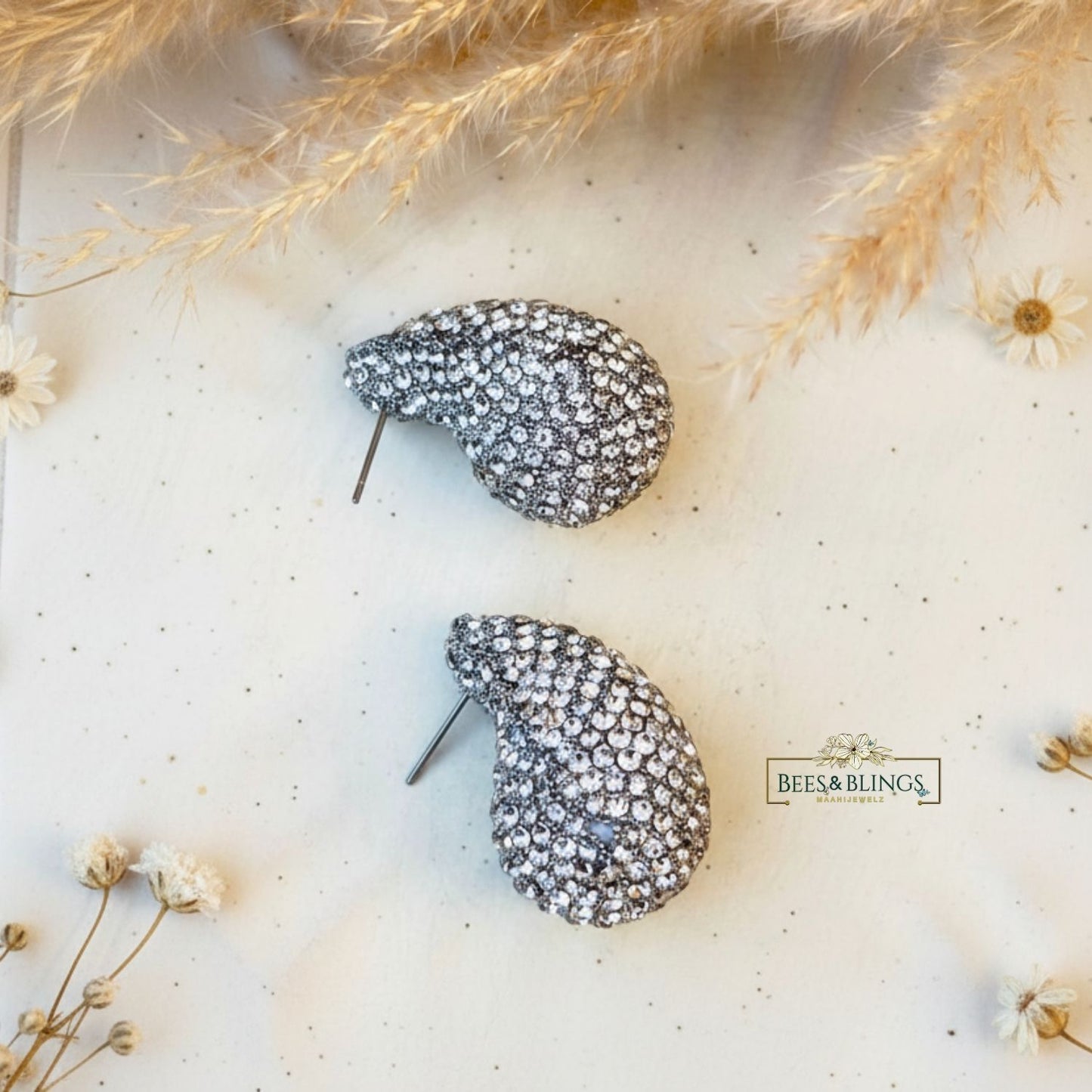 silver-tear-drop-statement-studs