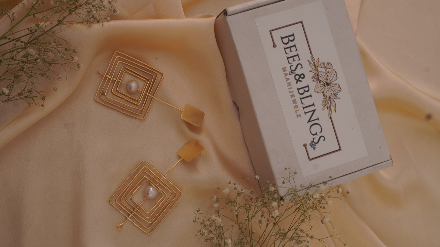 gold plated-twirling bead-long-earrings