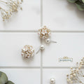 dual-pearl-statement-studs
