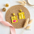 golden_face_abstract_earrings